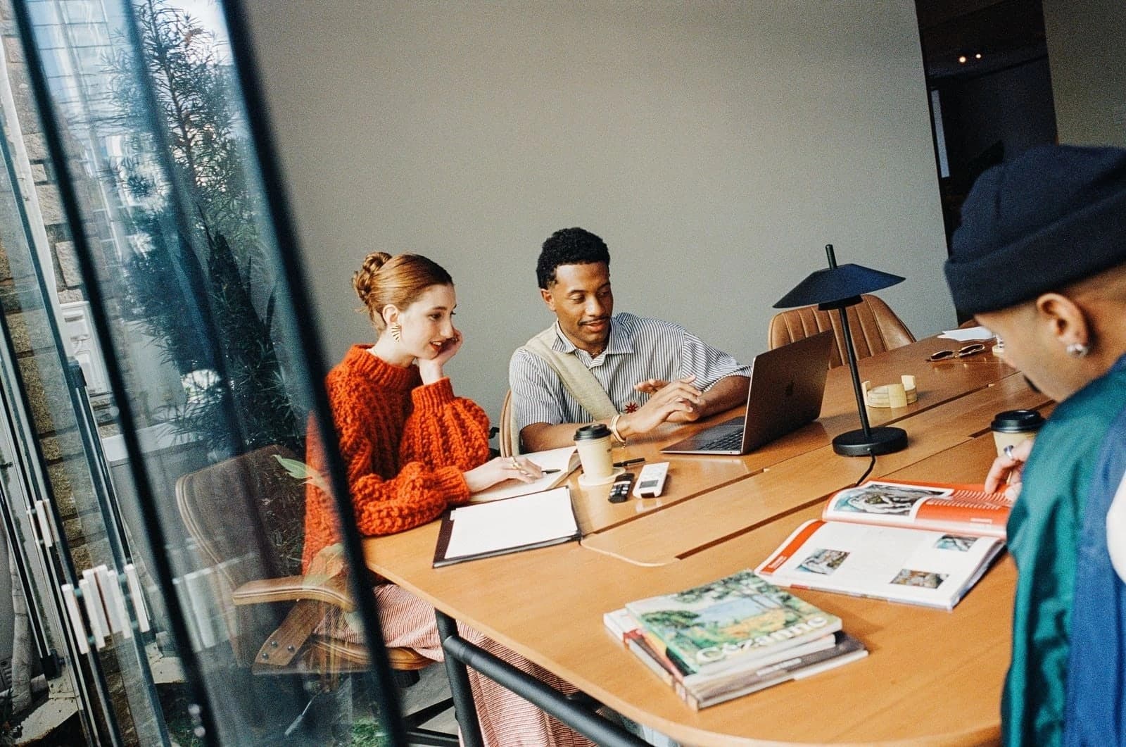 A team collaborating around a table in a bright office